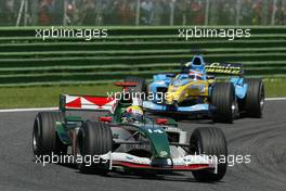 25.04.2004 Imola, San Marino, F1, Sunday, April, Mark Webber, AUS, Jaguar Racing, R5, Action, Track leads Fernando Alonso, ESP, Mild Seven Renault F1 Team, R24, Action, Track - Formula 1 World Championship, race, Rd 4, San Marino Grand Prix, RSM