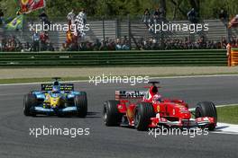 25.04.2004 Imola, San Marino, F1, Sunday, April, Rubens Barrichello, BRA, Scuderia Ferrari Marlboro, F2004, Action, Track leads Fernando Alonso, ESP, Mild Seven Renault F1 Team, R24, Action, Track - Formula 1 World Championship, race, Rd 4, San Marino Grand Prix, RSM
