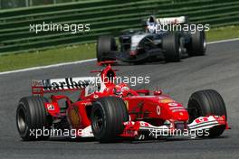 25.04.2004 Imola, San Marino, F1, Sunday, April, Michael Schumacher, GER, Ferrari leads Kimi Raikkonen, FIN, Räikkönen, McLaren Mercedes - Formula 1 World Championship, race, Rd 4, San Marino Grand Prix, RSM
