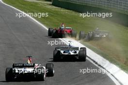 25.04.2004 Imola, San Marino, F1, Sunday, April, Michael Schumacher, GER, Ferrari forces Juan-Pablo Montoya, COL, BMW WilliamsF1 of the track - Formula 1 World Championship, race, Rd 4, San Marino Grand Prix, RSM