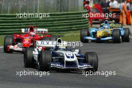 25.04.2004 Imola, San Marino, F1, Sunday, April, Ralf Schumacher, GER, BMW WilliamsF1 Team, FW26, Action, Track leads Rubens Barrichello, BRA, Scuderia Ferrari Marlboro, F2004, Action, Track - Formula 1 World Championship, race, Rd 4, San Marino Grand Prix, RSM