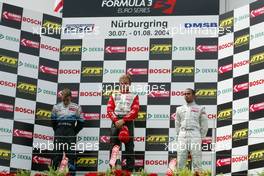 31.07.2004 Nürburg, Germany,  F3 Euro Series, Saturday, Podium, Nico Rosberg (FIN), Team Rosberg, Dallara F3-03 Opel (1st, center), Jamie Green (GBR), ASM F3, Dallara F3-03 Mercedes (2nd, left) and Lewis Hamilton (GBR), Manor Motorsport, Dallara F3-02 Mercedes (3rd, right) - F3 Euro Series 2004 at Nürburgring