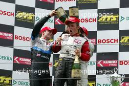 31.07.2004 Nürburg, Germany,  F3 Euro Series, Saturday, Podium, Jamie Green (GBR), ASM F3, Dallara F3-03 Mercedes (2nd. left) and Lewis Hamilton (GBR), Manor Motorsport, Dallara F3-02 Mercedes (3rd, right), giving race winner Nico Rosberg (FIN), Team Rosberg, Dallara F3-03 Opel (1st) a champaign shower - F3 Euro Series 2004 at Nürburgring