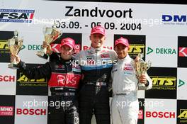 04.09.2004 Zandvoort, The Netherlands,  F3 Euro Series, Saturday, Podium, Eric Salignon (FRA), ASM F3, Dallara F3-03 Mercedes (1st, center), Nicolas Lapierre (FRA), OPEL Team Signature-Plus, Dallara F3-04 Opel (2nd, left) and Lewis Hamilton (GBR), Manor Motorsport, Dallara F3-02 Mercedes (3rd, right) - F3 Euro Series 2004 at Circuit Park Zandvoort