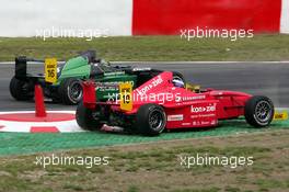 31.07.2004 Nürburg, Germany,  Formula BMW, Saturday, Rene Rast (GER), KUG / DEWALT Racing, short-cutting the chicane while fighting for position with Dominik Tiroch (AUT), HBR Motorsport GmbH - Formula BMW 2004 at Lausitzring