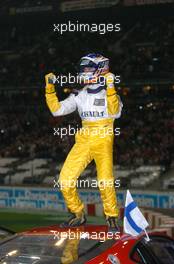 04.12.2004 Paris, France,  Saturday, Heikki Kovalainen (FIN), World Series by Nissan driver, Team RDD, Portrait, standing on top of the roof of his Ferrari 360 Modena Challenge, after winning the final from Michael Schumacher - 17th Race of Champions 2004, Stade de France, Paris, France