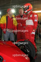 04.12.2004 Paris, France,  Saturday, Michael Schumacher (GER), F1 driver, Scuderia Ferrari, talking with people from Fast & Speed about the ROC cars - 17th Race of Champions 2004, Stade de France, Paris, France