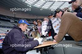 04.12.2004 Paris, France,  Saturday, Mattias Ekstrom (SWE), DTM driver, Team Abt-Audi, Portrait, signing autographs for fans - 17th Race of Champions 2004, Stade de France, Paris, France