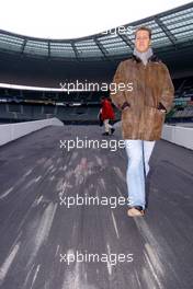 04.12.2004 Paris, France,  Saturday, Michael Schumacher (GER), F1 driver, Scuderia Ferrari, Portrait, inspecting the circuit - 17th Race of Champions 2004, Stade de France, Paris, France