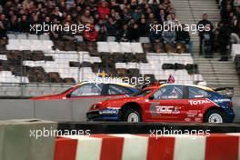 04.12.2004 Paris, France,  Saturday, A 1/4 final heat between Colin McRae (GBR), Rally driver, Team Nissan (front) and Mattias Ekstrom (SWE), DTM driver, Team Abt-Audi (rear), driving the Citroen Xsara WRC - 17th Race of Champions 2004, Stade de France, Paris, France