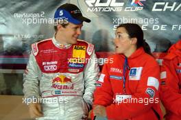 04.12.2004 Paris, France,  Saturday, Mattias Ekstrom (SWE), DTM driver, Team Abt-Audi, Portrait (left), talking with somebody from the Peugeot Sport WRC team - 17th Race of Champions 2004, Stade de France, Paris, France