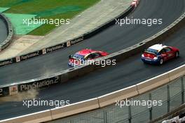 04.12.2004 Paris, France,  Saturday, Colin McRae (GBR), Rally driver, Team Nissan, hits the barrier (top) in his race against Mattias Ekstrom (SWE), DTM driver, Team Abt-Audi - 17th Race of Champions 2004, Stade de France, Paris, France