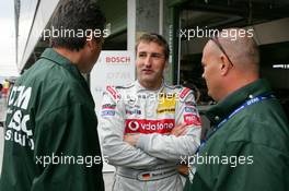 04.06.2005 Brno, Czech Republic,  Bernd Schneider (GER), Vodafone AMG-Mercedes, Portrait, explains his mariage / child situation to some of the DSO security guys - DTM 2005 at Automotodrom Brno, Czech Republic (Deutsche Tourenwagen Masters)