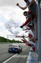 05.06.2005 Brno, Czech Republic,  Mattias Ekström (SWE), Audi Sport Team Abt Sportsline, Audi A4 DTM, passing his team after winning the race - DTM 2005 at Automotodrom Brno, Czech Republic (Deutsche Tourenwagen Masters)