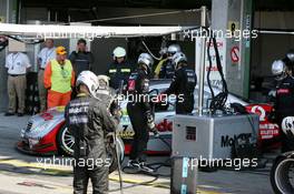 05.06.2005 Brno, Czech Republic,  Bernd Schneider (GER), Vodafone AMG-Mercedes, AMG-Mercedes C-Klasse, driving out of the pitbox in a strange way, behind the pitcrew - DTM 2005 at Automotodrom Brno, Czech Republic (Deutsche Tourenwagen Masters)