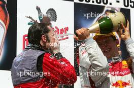 05.06.2005 Brno, Czech Republic,  Podium, Heinz-Harald Frentzen (GER), Opel Performance Center, Portrait (3rd, left), gets a champaign shower from Mattias Ekström (SWE), Audi Sport Team Abt Sportsline, Portrait (1st, right) - DTM 2005 at Automotodrom Brno, Czech Republic (Deutsche Tourenwagen Masters)