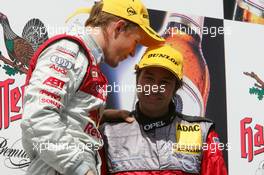 05.06.2005 Brno, Czech Republic,  Podium, Mattias Ekström (SWE), Audi Sport Team Abt Sportsline, Portrait (1st, left) and Heinz-Harald Frentzen (GER), Opel Performance Center, Portrait (3rd, right), talking - DTM 2005 at Automotodrom Brno, Czech Republic (Deutsche Tourenwagen Masters)