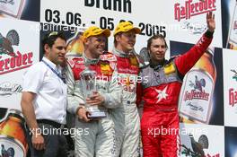 05.06.2005 Brno, Czech Republic,  Podium, Mattias Ekström (SWE), Audi Sport Team Abt Sportsline, Portrait (1st, center), Tom Kristensen (DNK), Audi Sport Team Abt, Portrait (2nd, left) and Heinz-Harald Frentzen (GER), Opel Performance Center, Portrait (3rd, right). Far left: Hans-Jurgen Abt (GER), Teamchef Abt-Audi - DTM 2005 at Automotodrom Brno, Czech Republic (Deutsche Tourenwagen Masters)