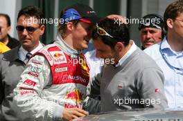 05.06.2005 Brno, Czech Republic,  Mattias Ekström (SWE), Audi Sport Team Abt Sportsline, Portrait (1st, left), talking with Hans-Jurgen Abt (GER), Teamchef Abt-Audi (right) - DTM 2005 at Automotodrom Brno, Czech Republic (Deutsche Tourenwagen Masters)