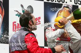 05.06.2005 Brno, Czech Republic,  Podium, Heinz-Harald Frentzen (GER), Opel Performance Center, Portrait (3rd), getting a champaign shower from Mattias Ekström (SWE), Audi Sport Team Abt Sportsline - DTM 2005 at Automotodrom Brno, Czech Republic (Deutsche Tourenwagen Masters)