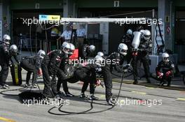 05.06.2005 Brno, Czech Republic,  Crew of Bernd Schneider (GER), Vodafone AMG-Mercedes, waiting for him to come in for a pitstop - DTM 2005 at Automotodrom Brno, Czech Republic (Deutsche Tourenwagen Masters)