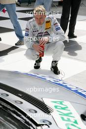 30.04.2005 Klettwitz, Germany,  Mika Häkkinen (FIN), Sport Edition AMG-Mercedes, Portrait, checks out the cars after qualifying - DTM 2005 at Eurospeedway Lausitzring (Deutsche Tourenwagen Masters)
