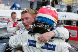 01.05.2005 Klettwitz, Germany,  Mika Häkkinen (FIN), Sport Edition AMG-Mercedes, Portrait, congratulates Gary Paffett (GBR), DaimlerChrysler Bank AMG-Mercedes with his victory - DTM 2005 at Eurospeedway Lausitzring (Deutsche Tourenwagen Masters)