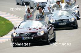 01.05.2005 Klettwitz, Germany,  Driver parade, with Bernd Schneider (GER), Vodafone AMG-Mercedes, Portrait (left) and Mika Häkkinen (FIN), Sport Edition AMG-Mercedes, Portrait (right), waving to the fans - DTM 2005 at Eurospeedway Lausitzring (Deutsche Tourenwagen Masters)