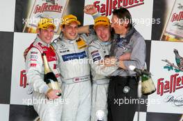 01.05.2005 Klettwitz, Germany,  Podium, Gary Paffett (GBR), DaimlerChrysler Bank AMG-Mercedes, Portrait (1st, center), Tom Kristensen (DNK), Audi Sport Team Abt, Portrait (2nd, left) and Mika Häkkinen (FIN), Sport Edition AMG-Mercedes, Portrait (3rd, right). Far right: Hans-Jürgen Mattheis (GER), Team Manager HWA - DTM 2005 at Eurospeedway Lausitzring (Deutsche Tourenwagen Masters)