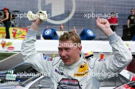 01.05.2005 Klettwitz, Germany,  Mika Häkkinen (FIN), Sport Edition AMG-Mercedes, AMG-Mercedes C-Klasse, happy with his 3rd place in just his 2nd DTM race - DTM 2005 at Eurospeedway Lausitzring (Deutsche Tourenwagen Masters)