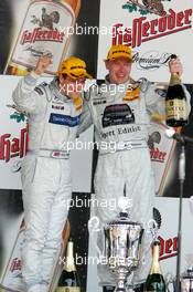 01.05.2005 Klettwitz, Germany,  Podium, Gary Paffett (GBR), DaimlerChrysler Bank AMG-Mercedes, Portrait (1st, left) and Mika Häkkinen (FIN), Sport Edition AMG-Mercedes, Portrait (3rd, right) - DTM 2005 at Eurospeedway Lausitzring (Deutsche Tourenwagen Masters)