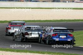 01.05.2005 Klettwitz, Germany,  Martin Tomczyk (GER), Audi Sport Team Abt Sportsline, Audi A4 DTM and Jean Alesi (FRA), AMG-Mercedes, AMG-Mercedes C-Klasse, fighting for position - DTM 2005 at Eurospeedway Lausitzring (Deutsche Tourenwagen Masters)