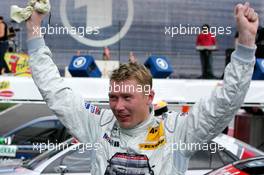 01.05.2005 Klettwitz, Germany,  Mika Häkkinen (FIN), Sport Edition AMG-Mercedes, AMG-Mercedes C-Klasse, happy with his 3rd place in just his 2nd DTM race - DTM 2005 at Eurospeedway Lausitzring (Deutsche Tourenwagen Masters)