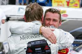 01.05.2005 Klettwitz, Germany,  Mika Häkkinen (FIN), Sport Edition AMG-Mercedes (seen on the rear) and Tom Kristensen (DNK), Audi Sport Team Abt, Portrait, congratulate each other after fighting for 2nd place during the latter part of the race - DTM 2005 at Eurospeedway Lausitzring (Deutsche Tourenwagen Masters)