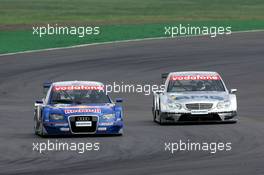 01.05.2005 Klettwitz, Germany,  Fight for position between Martin Tomczyk (GER), Audi Sport Team Abt Sportsline, Audi A4 DTM (left) and Jean Alesi (FRA), AMG-Mercedes, AMG-Mercedes C-Klasse (right) - DTM 2005 at Eurospeedway Lausitzring (Deutsche Tourenwagen Masters)