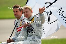 01.05.2005 Klettwitz, Germany,  Driver parade, Mika Häkkinen (FIN), Sport Edition AMG-Mercedes, Portrait, waving to the fans. Bernd Schneider (GER), Vodafone AMG-Mercedes, Portrait, in the background - DTM 2005 at Eurospeedway Lausitzring (Deutsche Tourenwagen Masters)