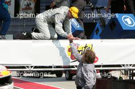 01.05.2005 Klettwitz, Germany,  Norbert Haug (GER), Sporting Director Mercedes-Benz, congratulates Mika Häkkinen (FIN), Sport Edition AMG-Mercedes, Portrait (3rd) - DTM 2005 at Eurospeedway Lausitzring (Deutsche Tourenwagen Masters)