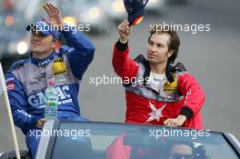 01.05.2005 Klettwitz, Germany,  Driver parade, Marcel Fässler (SUI), Opel Performance Center, Portrait (left) and Heinz-Harald Frentzen (GER), Opel Performance Center, Portrait (right), waving to the fans - DTM 2005 at Eurospeedway Lausitzring (Deutsche Tourenwagen Masters)