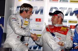 17.09.2005 Klettwitz, Germany,  Tom Kristensen (DNK), Audi Sport Team Abt, Portrait (right), congratulates Jamie Green (GBR), Salzgitter AMG-Mercedes, Portrait (left), with his pole position - DTM 2005 at Lausitzring (Deutsche Tourenwagen Masters)