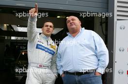 17.09.2005 Klettwitz, Germany,  Gary Paffett (GBR), DaimlerChrysler Bank AMG-Mercedes, Portrait, points his friend to the place where his fans are sitting on the grandstand - DTM 2005 at Lausitzring (Deutsche Tourenwagen Masters)