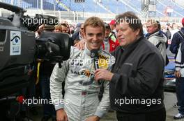 17.09.2005 Klettwitz, Germany,  Pole sitter Jamie Green (GBR), Salzgitter AMG-Mercedes, Portrait, talks with Norbert Haug (GER), Sporting Director Mercedes-Benz, in front of TV - DTM 2005 at Lausitzring (Deutsche Tourenwagen Masters)