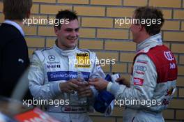 18.09.2005 Klettwitz, Germany,  Gary Paffett (GBR), DaimlerChrysler Bank AMG-Mercedes, Portrait (2nd, left) and Mattias Ekström (SWE), Audi Sport Team Abt Sportsline, Portrait (1st, right), chatting after the race - DTM 2005 at Lausitzring (Deutsche Tourenwagen Masters)