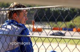 18.09.2005 Klettwitz, Germany,  Marcel Fässler (SUI), Opel Performance Center, Portrait, sitting behind the fence, after retiring from the race due to a collision - DTM 2005 at Lausitzring (Deutsche Tourenwagen Masters)