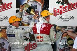 18.09.2005 Klettwitz, Germany,  Gary Paffett (GBR), DaimlerChrysler Bank AMG-Mercedes, Portrait (2nd, left), gives Mattias Ekström (SWE), Audi Sport Team Abt Sportsline, Portrait (1st, right), a champsign shower - DTM 2005 at Lausitzring (Deutsche Tourenwagen Masters)