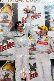 17.04.2005 Hockenheim, Germany,  Podium, Bernd Schneider (GER), Vodafone AMG-Mercedes, Portrait (2nd, right), cheers with Jean Alesi (FRA), AMG-Mercedes, Portrait (1st, left) - DTM 2005 at Hockenheimring Baden-Württemberg (Deutsche Tourenwagen Masters)