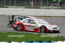 17.04.2005 Hockenheim, Germany,  Bernd Schneider (GER), Vodafone AMG-Mercedes, AMG-Mercedes C-Klasse, overtakes Pierre Kaffer (GER), Audi Sport Team Joest Racing, Audi A4 DTM - DTM 2005 at Hockenheimring Baden-Württemberg (Deutsche Tourenwagen Masters)