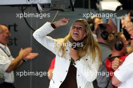 22.10.2005 Hockenheim, Germany,  Eve Scheer (GER), girlfriend of Frank Stippler and German actrice, cheering when her boyfriend sets the fastest laptime so far in qualifying and thus takes provisional pole position - DTM 2005 at Hockenheimring (Deutsche Tourenwagen Masters)