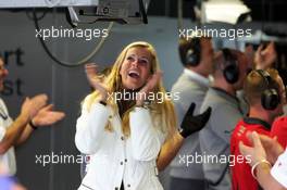 22.10.2005 Hockenheim, Germany,  Eve Scheer (GER), girlfriend of Frank Stippler and German actrice, cheering when her boyfriend sets the fastest laptime so far in qualifying and thus takes provisional pole position - DTM 2005 at Hockenheimring (Deutsche Tourenwagen Masters)