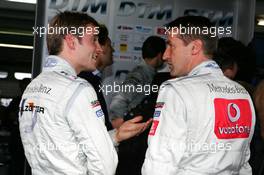 22.10.2005 Hockenheim, Germany,  Jamie Green (GBR), Salzgitter AMG-Mercedes, Portrait (1st, left), talking with Bernd Schneider (GER), Vodafone AMG-Mercedes, Portrait, who was not able to beat his teammate - DTM 2005 at Hockenheimring (Deutsche Tourenwagen Masters)