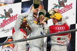 23.10.2005 Hockenheim, Germany,  Podium, 2005 DTM champion, Gary Paffett (GBR), DaimlerChrysler Bank AMG-Mercedes, Portrait, gets a champaign shower from the runners up in the championship, Mattias Ekström (SWE), Audi Sport Team Abt Sportsline, Portrait (2nd, left) and Tom Kristensen (DNK), Audi Sport Team Abt, Portrait (3rd, right) - DTM 2005 at Hockenheimring (Deutsche Tourenwagen Masters)